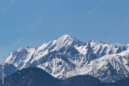 Snowy mountain peaks on a clear sunny day