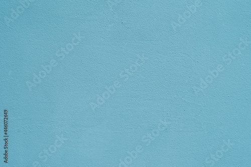 Painted turquoise blue wall, bright texture for modern backdrop