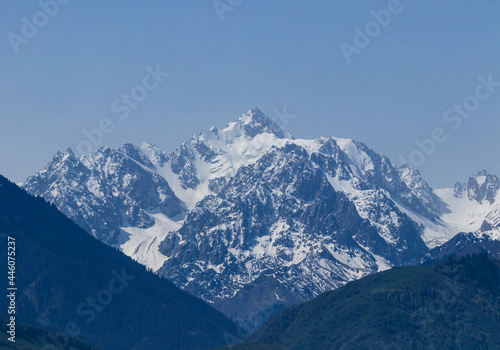 View of the Nursultan mountain peak in the snow between the gorge