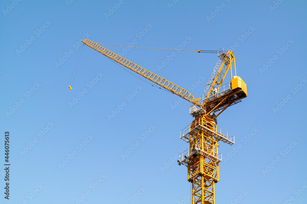 High tower crane at construction site. High tower crane at construction site.