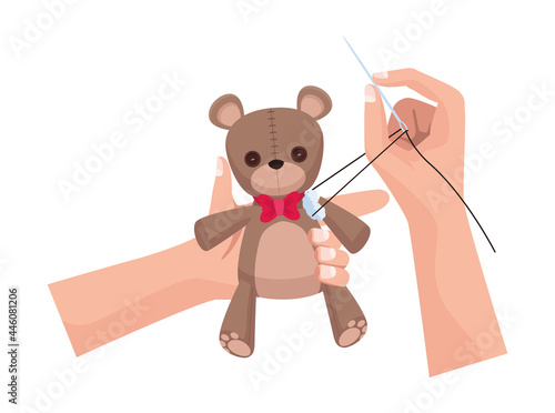 hands sewing teddy