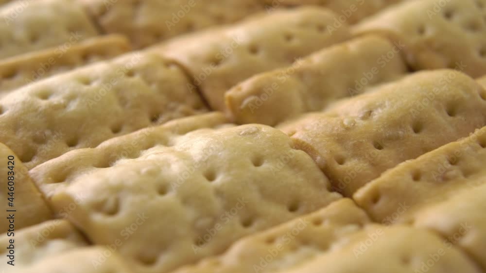 Crispy crackers in rows. Macro. Rotation Crispy crackers in rows. Macro. Rotation