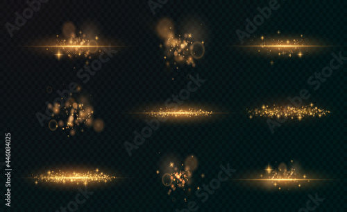 Gold sparkling dust with gold sparkling stars on a transparent background. Glittering texture. Christmas effect for luxury greeting rich card.	
