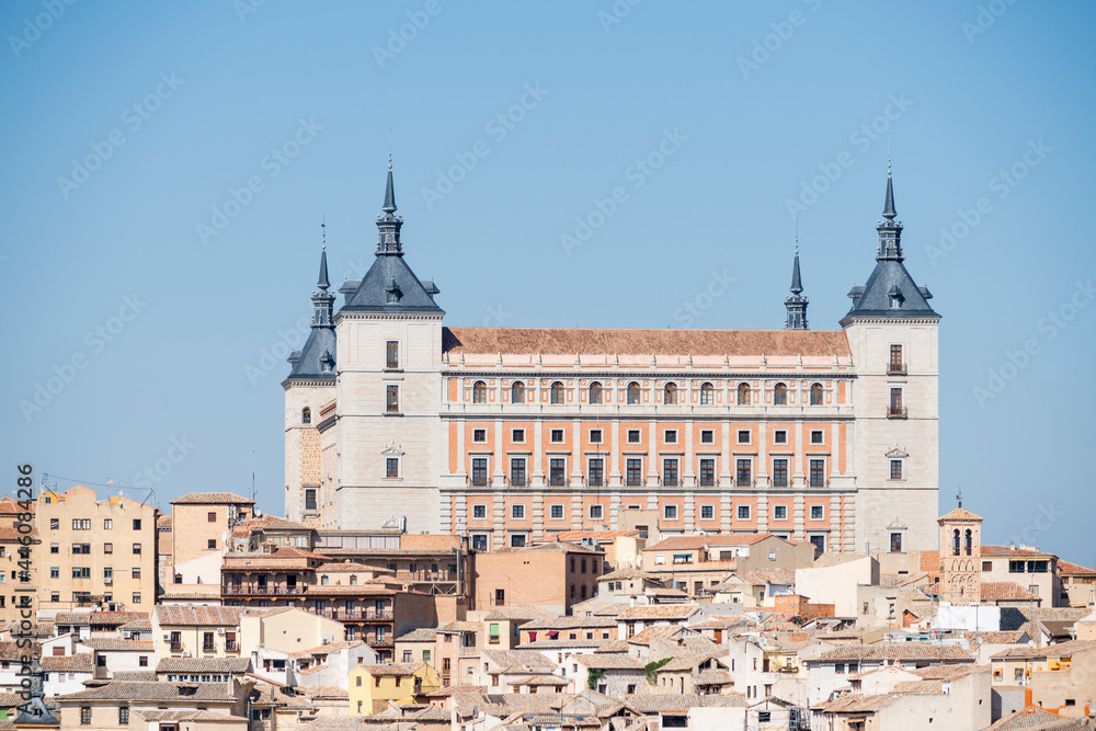 panoramic view of the Alcazar of Toledo and part of the surrounding houses one sunny and torrid afternoon in Castilian summer