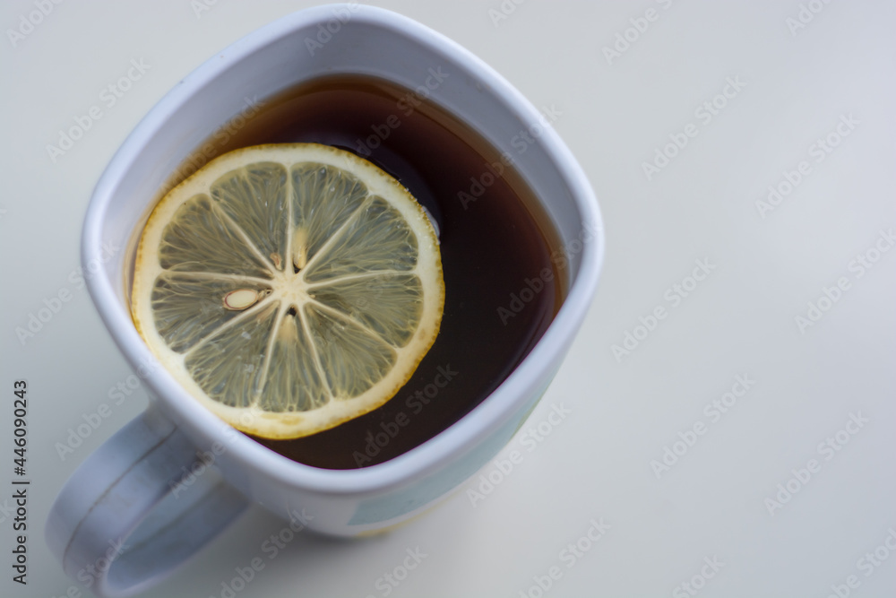 cup of tea with lemon. cup of coffee with lemon in white background cup of tea with lemon. cup of coffee with lemon in white background