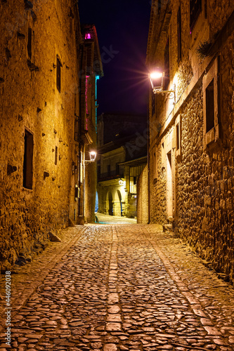 Narrow alley in ancient stone village at night. Santillana del Mar  Santander.