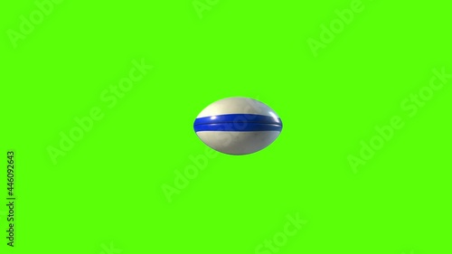 Side on view of a 3D ruby ball with blue lines spinning around. Standard rugby ball in a continuous spin perfect for sports advertising. Green screen footage for isolating the ball.