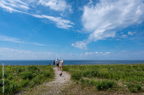 Unrecognizable people enjoy the northwest coast of Swedish Baltic Sea island Oland. The island is a popular tourist destination known as the island of sun and wind. photo