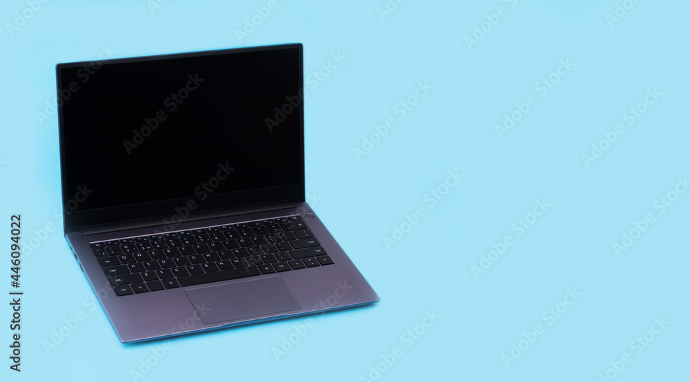 laptop on a blue background with a copy space laptop on a blue background with a copy space