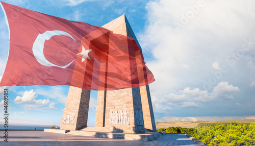 Canakkale Martyrs' Memorial on the foreground Turkish flag - Canakkale, Turkey photo