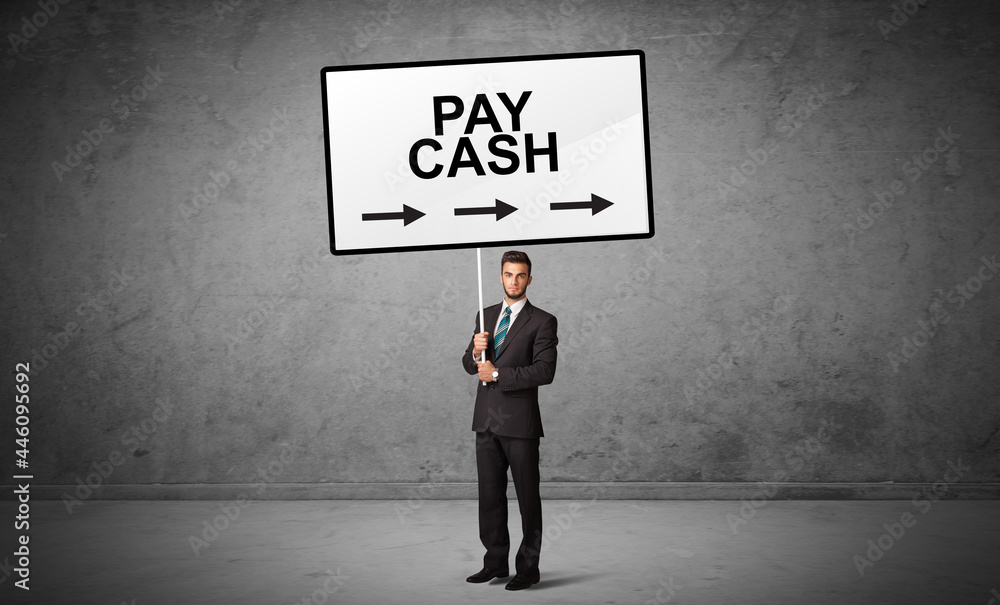 business person holding a traffic sign