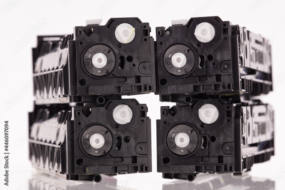 Four used laser printer toner cartridges isolated white background. Four used laser printer toner cartridges isolated white background.