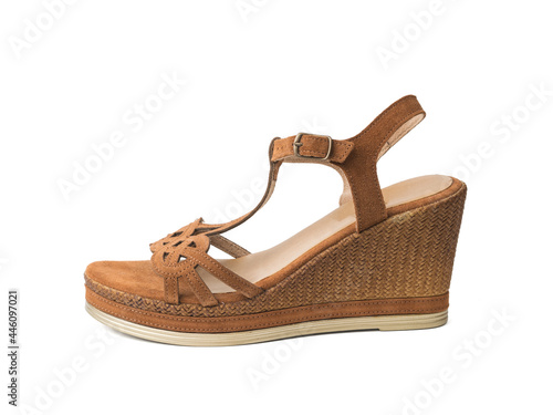 Women's sandals made of brown suede with high heels isolated on a white background.