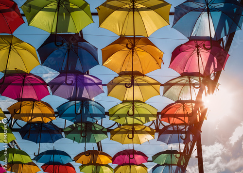 Colorful umbrellas. Colorful umbrellas in the sky. Street decoration from umbrellas. Background of umbrellas. 