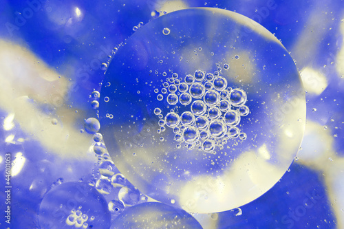 Oil bubbles close up. circles of water macro. abstract light blue background