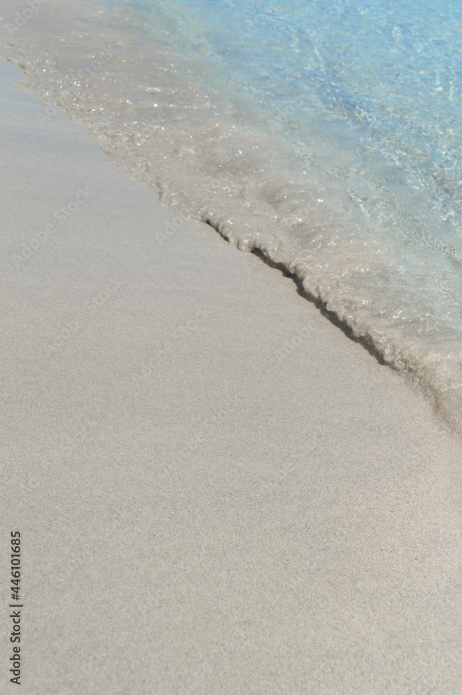 The blue sea water washed over the white sand. The blue sea water washed over the white sand.