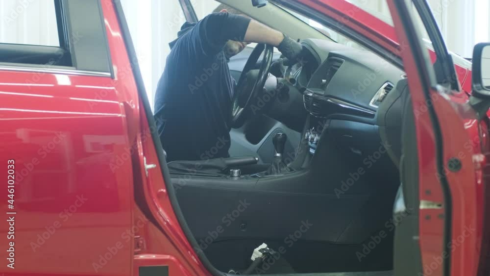 Professional car cleaning. Сar wash. Interior detailing. Dry clean and detail a car interior. Deep seats cleaning. Wiping foam in car wash. Cleaning the car panel from dust. A vacuum cleaner Professional car cleaning. Сar wash. Interior detailing. Dry clean and detail a car interior. Deep seats cleaning. Wiping foam in car wash. Cleaning the car panel from dust. A vacuum cleaner