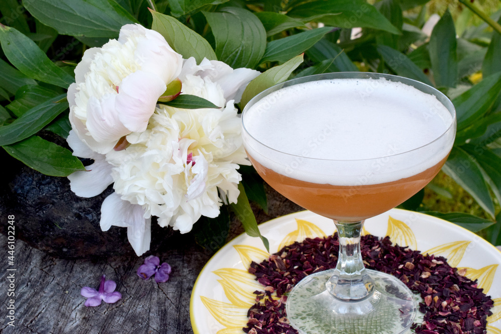 Pineapple Shochu cocktail with Lime and hibiscus, Peony background Pineapple Shochu cocktail with Lime and hibiscus, Peony background