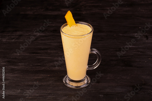 mango pulp juice with a piece of fresh mango 
