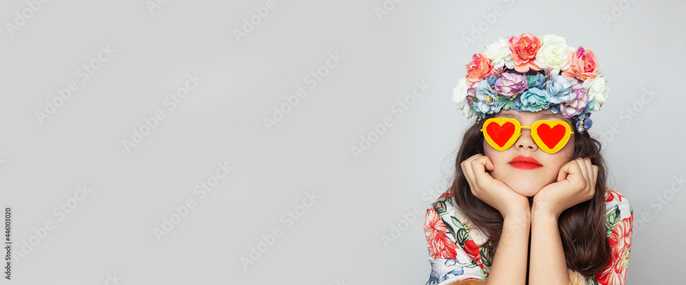 Portrait of a girl with a flower crown and yellow glasses Portrait of a girl with a flower crown and yellow glasses