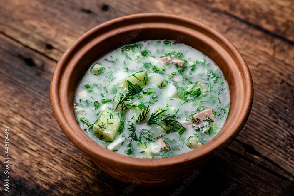 Okroshka, Russian cold soup on a wooden background. Okroshka, Russian cold soup on a wooden background.