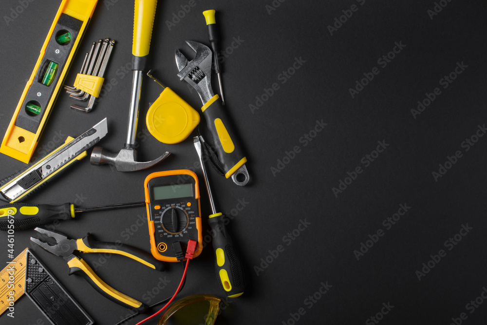 Set of hand tools on a black background. Copy space.