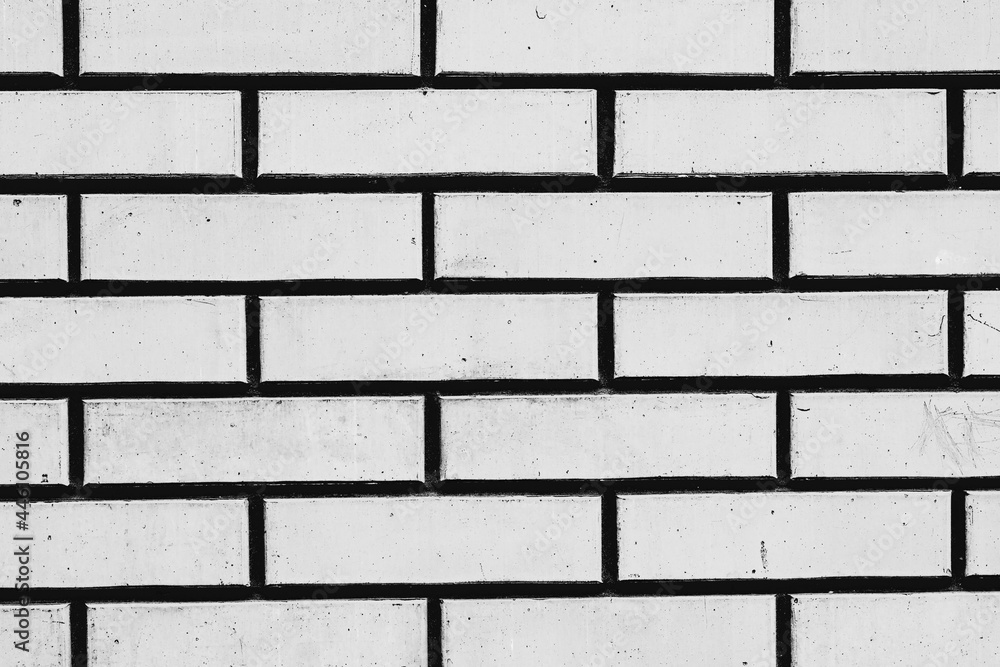 Obraz premium Texture of a brick wall with cracks and scratches which can be used as a background