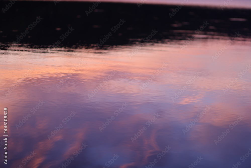 reflection of pink sunset light on the river
