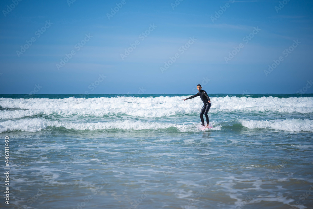 Fototapeta premium the guy on the surfboard caught the wave. Concept: balance, stability, coordination