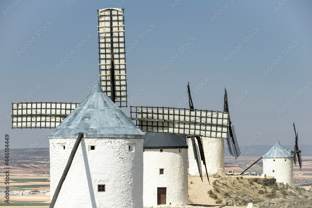 Windmills or giants on the Don Quixote tourist route among the farms of Castilla la Mancha