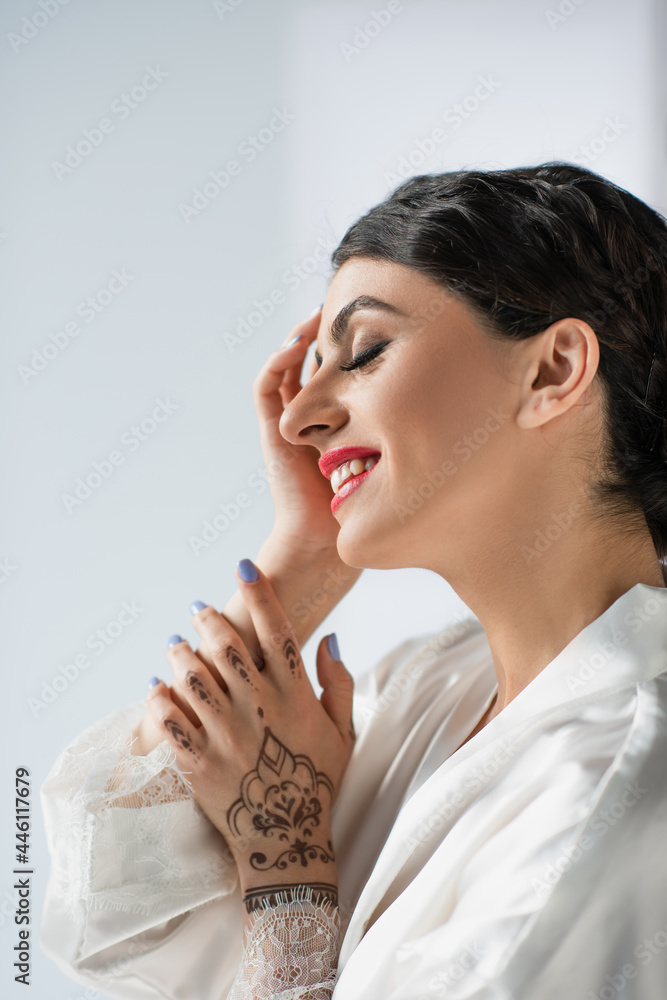 young and happy indian bride smiling isolated on white young and happy indian bride smiling isolated on white