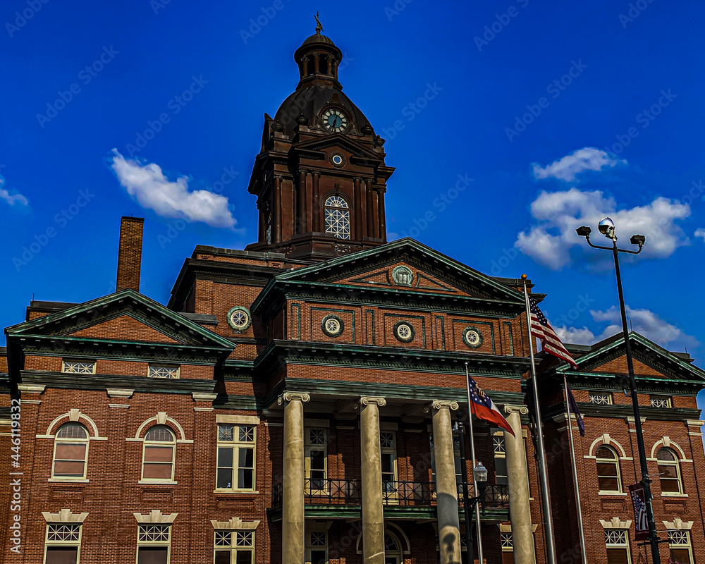 Newnan Georgia historic city courthouse with a blue sky background
