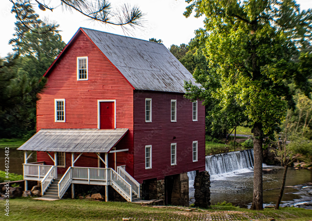 Red Starr's Mill historic millhouse, dam and waterfall in Fayette county Georgia during sunrise in summer Red Starr's Mill historic millhouse, dam and waterfall in Fayette county Georgia during sunrise in summer