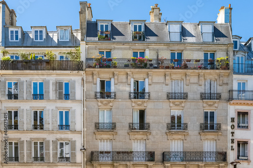 Paris, typical facade, beautiful building in the center with an hotel sign
 photo