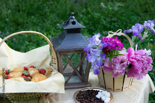 Croissant,strawberries,flowers and coffee,morning breakfast.