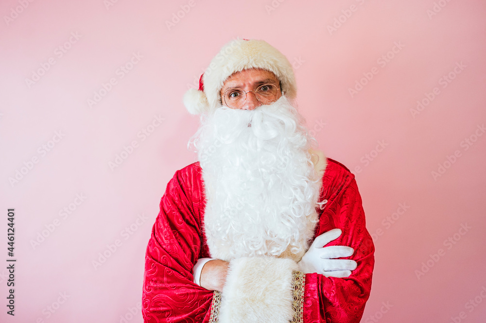 Man dressed as Santa Claus looking at camera Man dressed as Santa Claus looking at camera