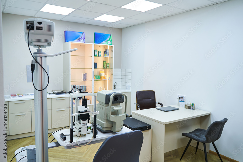 Optician cabinet with optometry equipment and work table