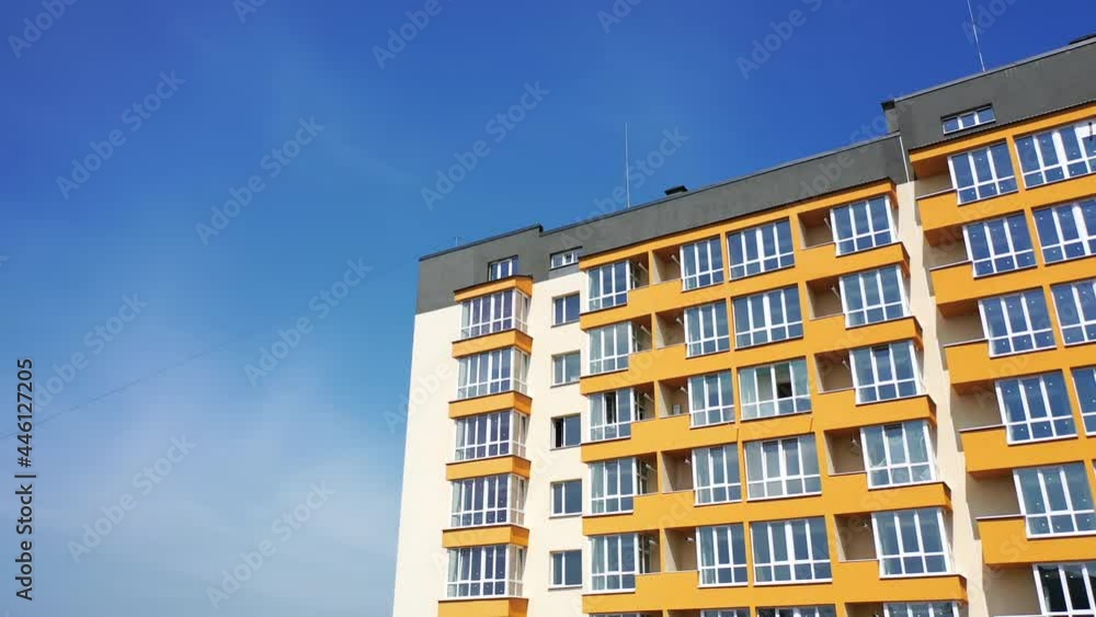 View from the drone of the contemporary residential building in the city. Exterior of a modern design of multistory apartment building. Aerial view. View from the drone of the contemporary residential building in the city. Exterior of a modern design of multistory apartment building. Aerial view.