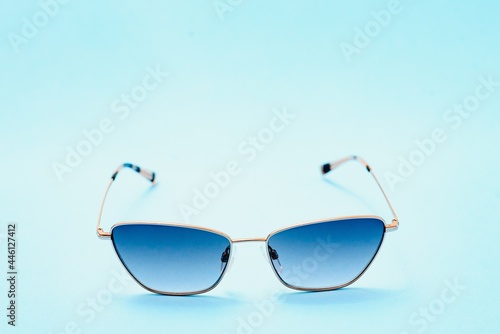 Beautiful trendly sunglasses on a Classic Blue Pantone color of the year background