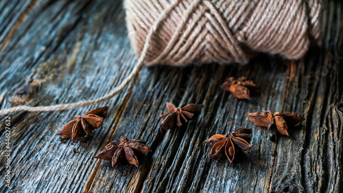 Anise on rustic wooden background