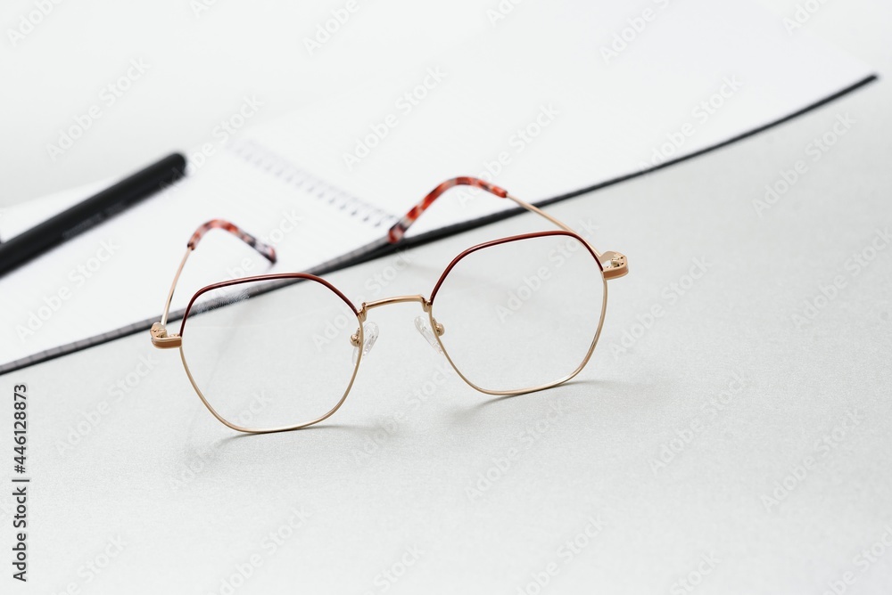 notebook, glasses, pen on a white background top view, school, education, knowledge notebook, glasses, pen on a white background top view, school, education, knowledge