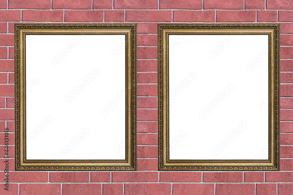 Fototapeta premium two wooden frames with a carved pattern for paintings on a brick wall background