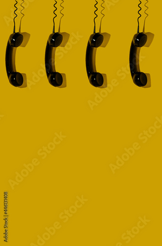 Handset isolated on a yellow background. Creative concept of communication. 