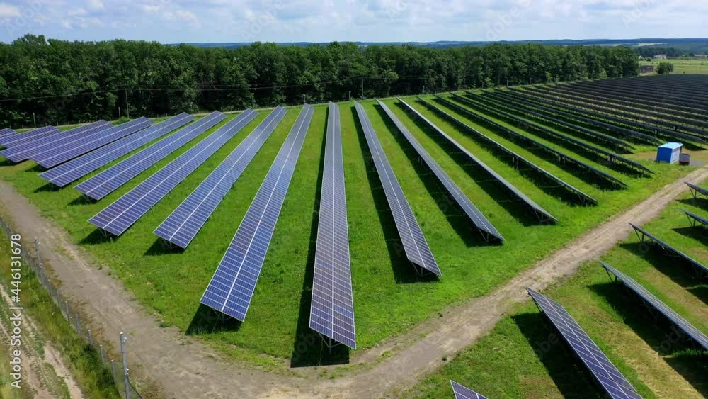 Motion camera view of the solar panels with blue sky background ...
