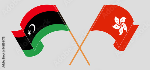 Crossed and waving flags of Libya and Hong Kong