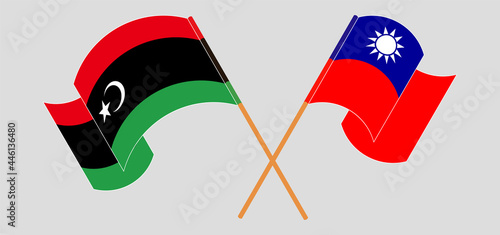 Crossed and waving flags of Libya and Taiwan