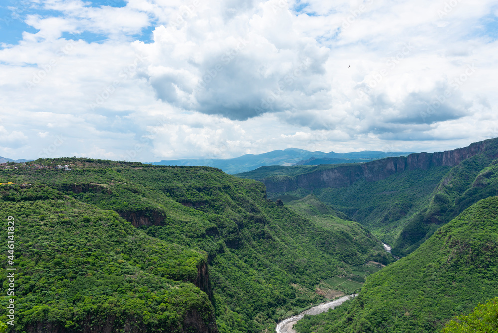 Fototapeta premium aerial view on top of the moutain of barranca de huentitan in the city guadalajara mexico