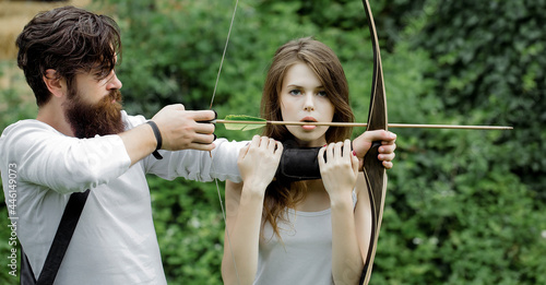 Attractive couple shoots out of the bow