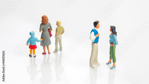 miniature people. concept of family people in relationships on a white background. the problem of fidelity in marriage. raising children in problematic relationships in the family