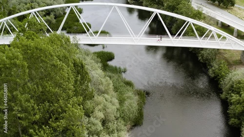 Arched Bridge At Soto Island Nature Preserve Going To Aldehuela Park In Salamanca, Spain. aerial photo